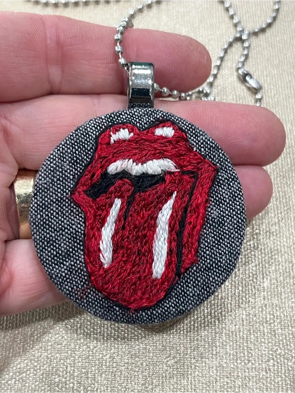 Rolling Stones tongue out hand embroidered thread paint pendant necklace